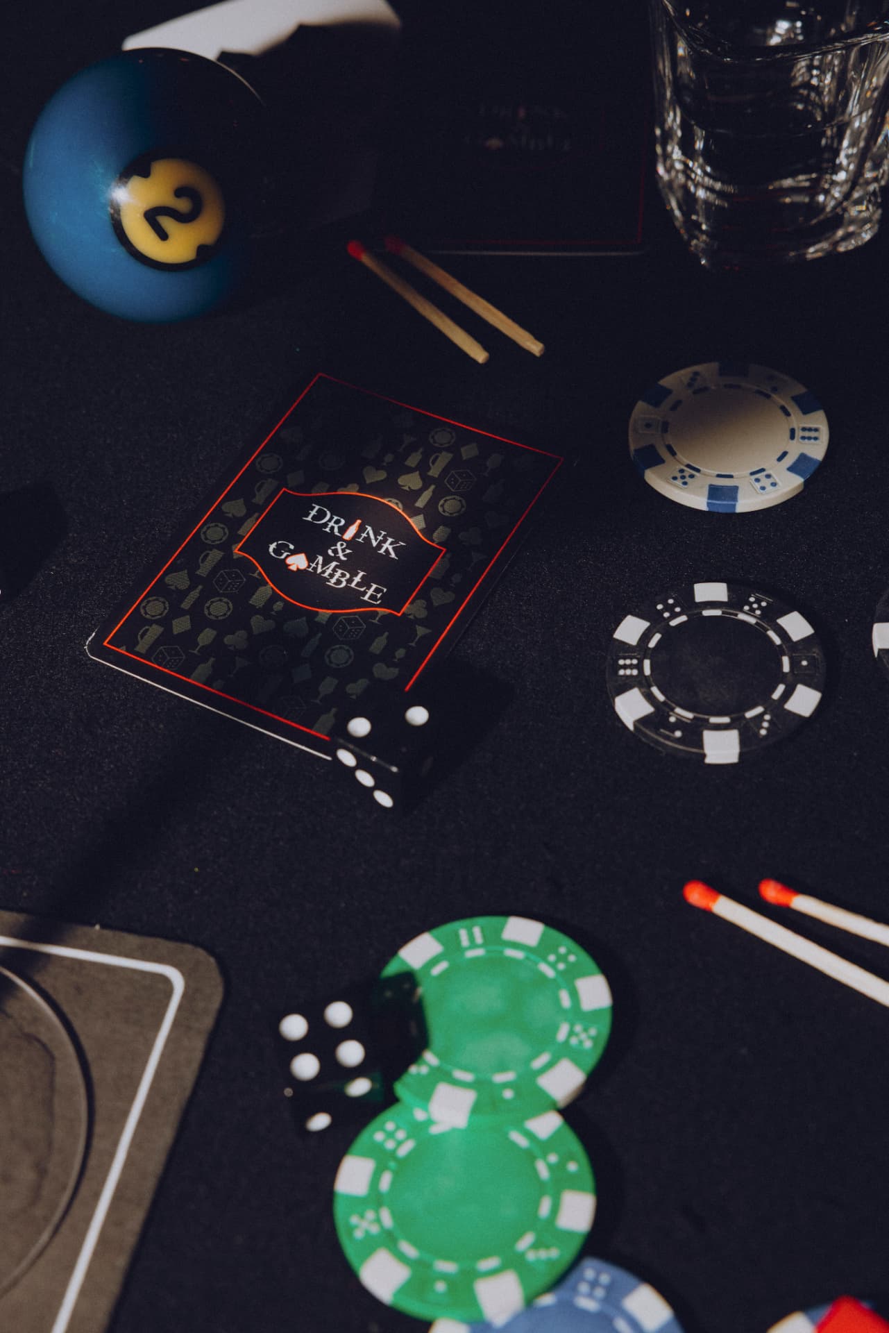Drink & Gamble playing cards with dice, poker chips and matches